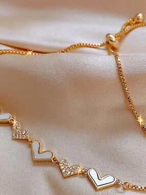 Gold Heart Link Bracelet with White Enamel Accents